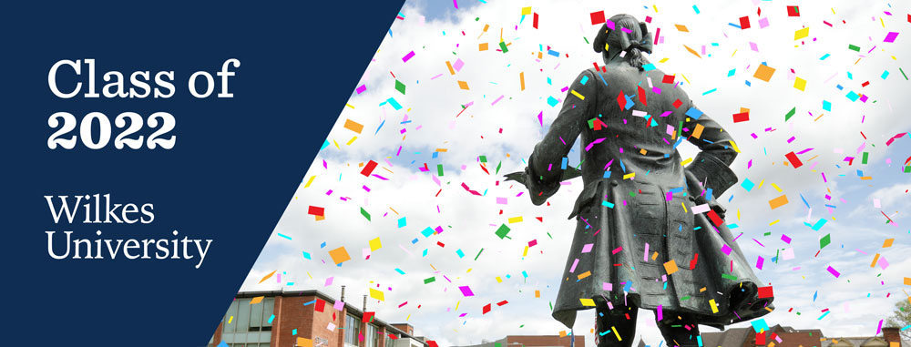 social media banner featuring a photo of john wilkes statue with confetti